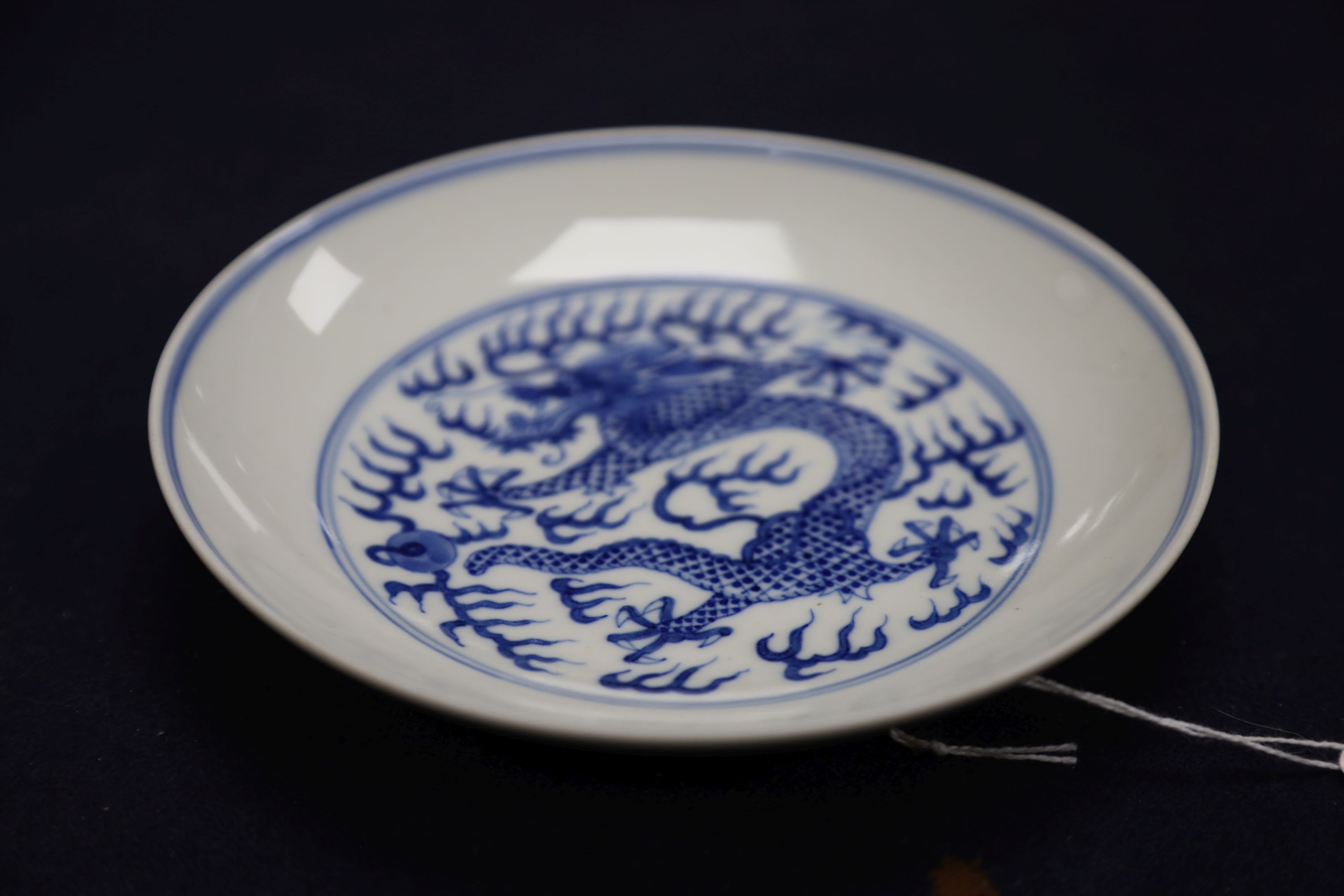 A Chinese blue and white landscape bowl, a/f and a Chinese blue and white 'dragon' dish, 18cm and 16.5cm